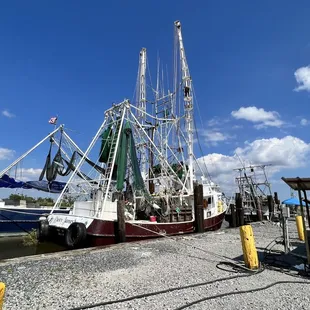 a shrimp boat docked at a dock