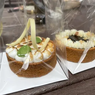 two desserts wrapped in plastic