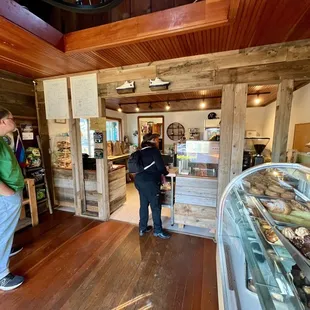 a man and a woman in a bakery
