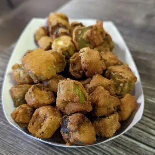 a plate of fried okonouts