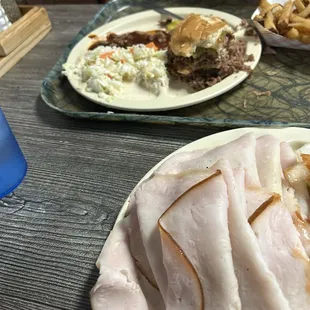 Turkey and a chopped beef sandwich with slaw and fries