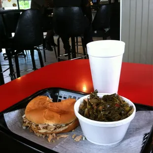 Pulled pork and coleslaw "Working Man's" sandwich, collard greens and sweet tea for $5 ...makin me happy!