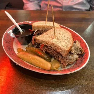 Brisket on rye with some tasty pickles.