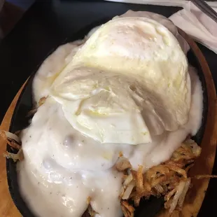 a fried egg and hash browns