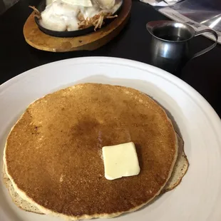 a plate of pancakes with butter