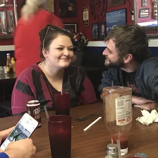 a man and a woman sitting at a table
