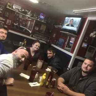a group of men sitting around a table