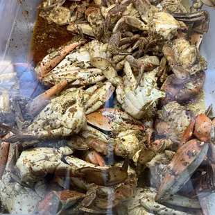 a container of cooked crabs