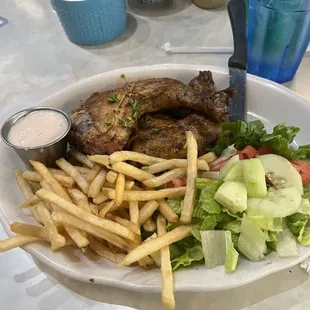 Chicken legs with fries and veggies