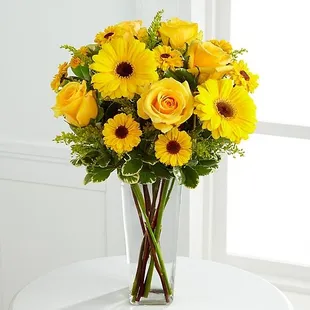 The Daylight™ Bouquet bursts with sun-filled excitement and cheer expressed through each radiant bloom...