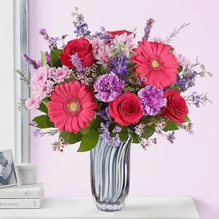 A romantic gift for your one-and-only. Our stunning arrangement showcases vibrant pink and purple blooms...