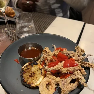 Calamari, not half eaten, that what it looked like when it arrived.