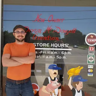 a man standing in front of a store