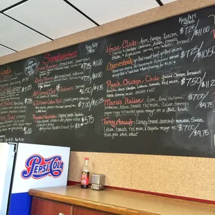 Chalkboard selection of different Salads &amp; Sandwiches &amp; more