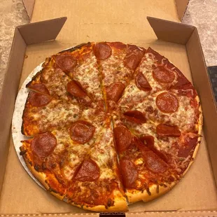 a pepperoni pizza in a box