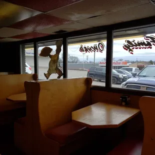 a statue of a baseball player on a bench