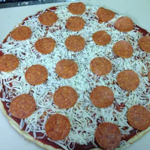 Uncooked pizza I got. Easy to cook very good!