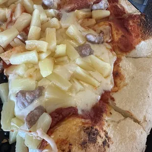 Large pineapple and sausage pizza