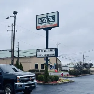a truck parked in front of a restaurant