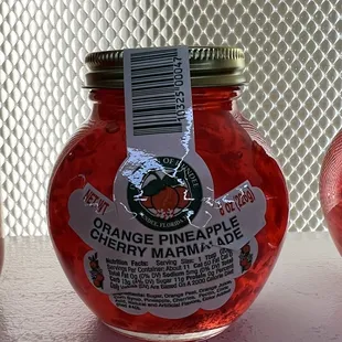 a jar of orange pineapple marmalade