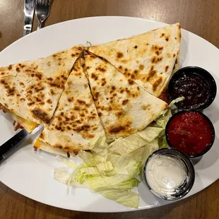 Chicken and cheese quesadilla with sautéed peppers and onions. It was DELICIOUS!!!