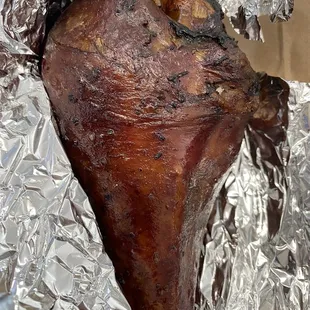 a piece of meat wrapped in tin foil