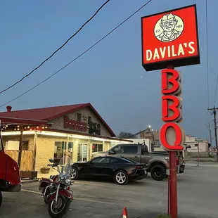 two motorcycles parked in front of a restaurant