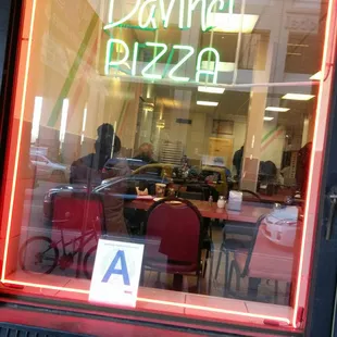 a neon sign in the window