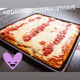 a square pizza on a pan