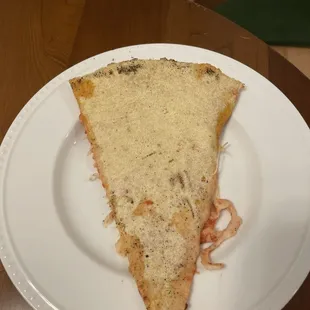 The bottom of a severely underbaked mushroom pizza that I had to wait 45 minutes longer than the promised time to get.