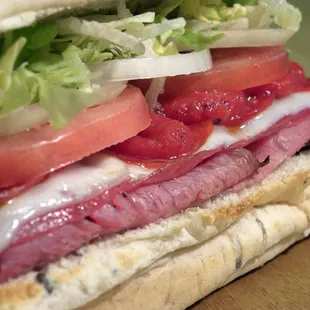 a sandwich with meat and vegetables