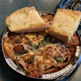 a plate of pizza and bread