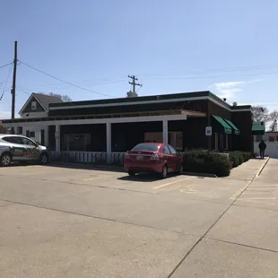 two cars parked in a parking lot