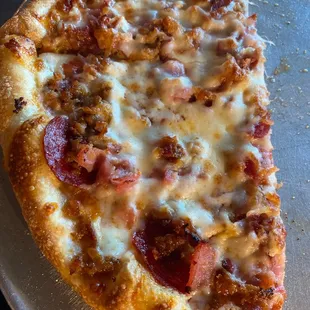 a slice of pepperoni pizza
