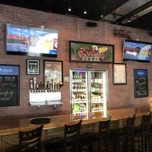 a bar with a brick wall