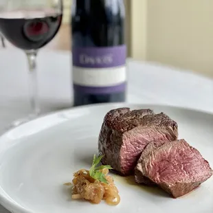 a bottle of wine in the background