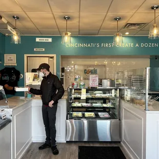 a man standing in front of the counter