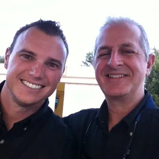 The winemaker (right) Marshall and his son-in-law (left) Trenton pouring at a wine event.