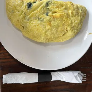 Spinach tomato feta omelette with sausage added - big!