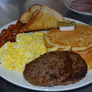 Large Breakfast special. 
2 pancakes, 2 meats, your choice of how you want your eggs cooks and your choice of toast