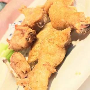 plate of fried chicken with a side of celery