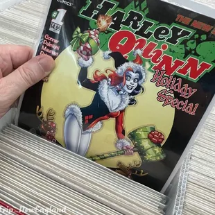 a person holding a comic book