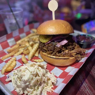 a pulled pork sandwich and fries