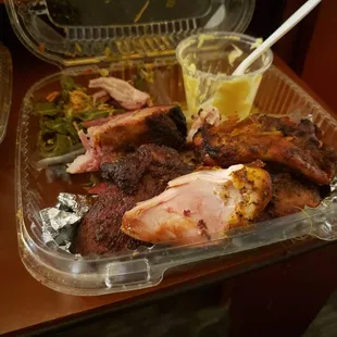 Ribs, chicken, potato salad, greens