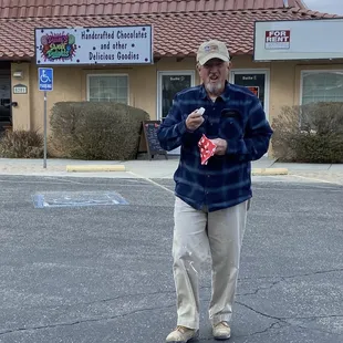 Pastor Ronnie caught with his hand in the cookie jar !!...actually a white chocolate peanut butter delight !!...LOL !!