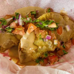 Taconadas. Taco meat, bean and cheddar filled empanada.