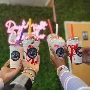 a group of people holding drinks
