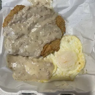 Chicken fried steak with two over easy eggs that I ordered scrambled. Missing the hash browns.