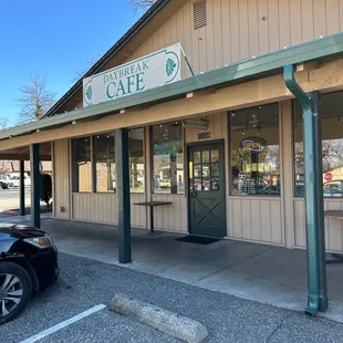 a car parked in front of the cafe
