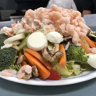 a plate of seafood and vegetables